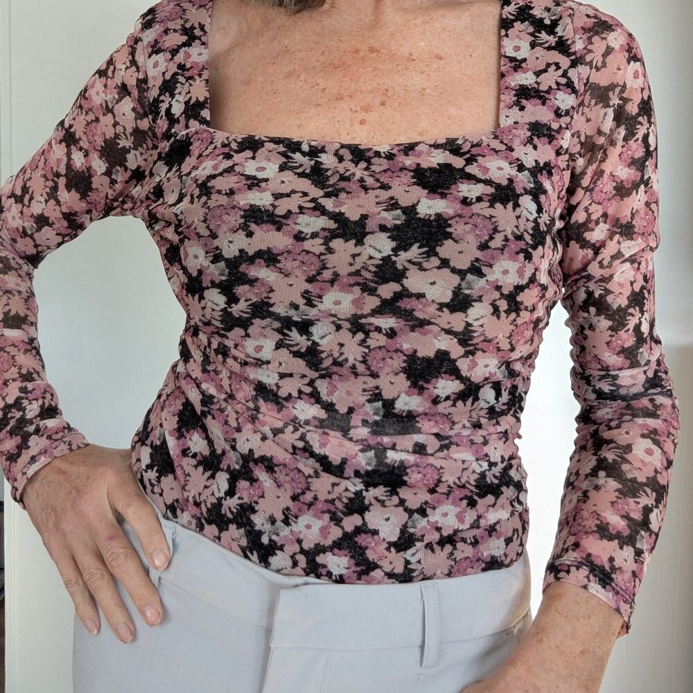 12 Thompson long sleeved, square necked floral body suit